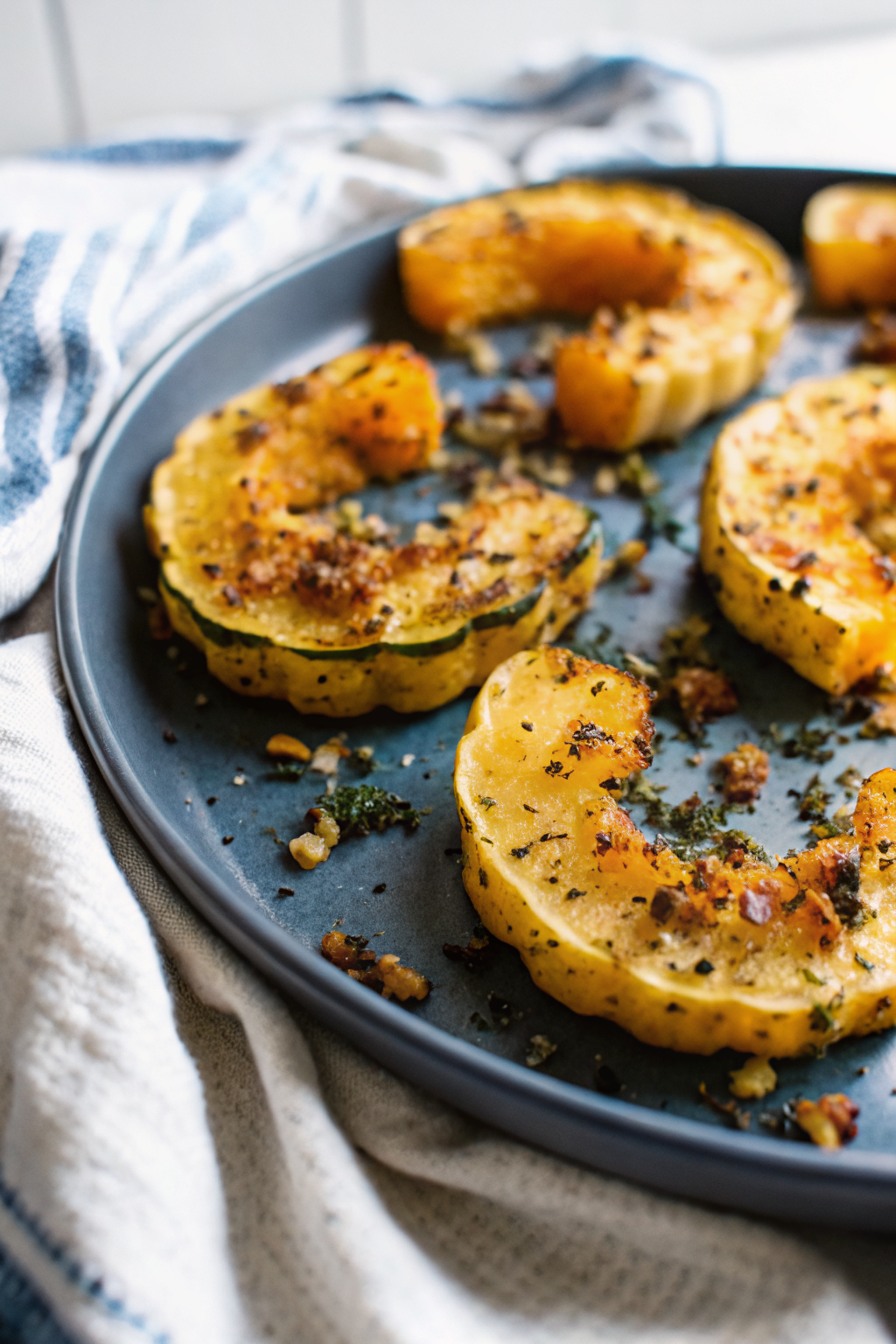 Parmesan Crusted Delicata Squash slice on plate showing perfect texture and swirl pattern